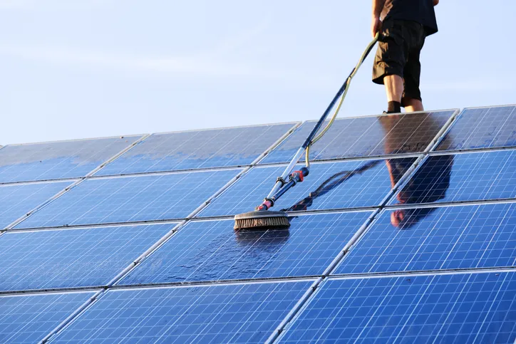 Gently professionally cleaning solar panels to keep their efficiency